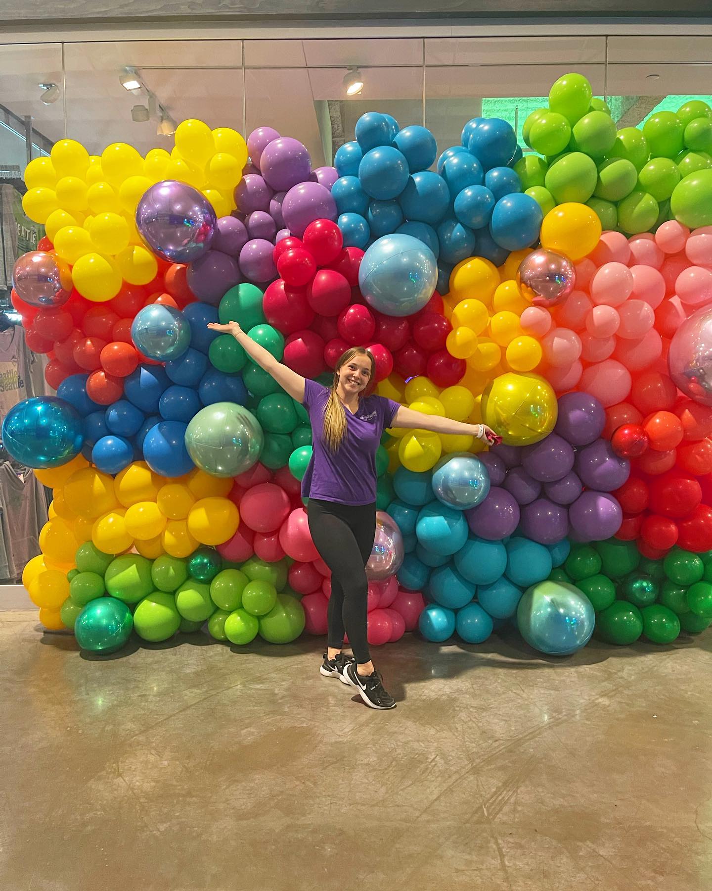 Colorful floor-to-ceiling balloon wall created by Balloon Masters